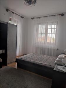 Postel nebo postele na pokoji v ubytování Hajni apartmanház