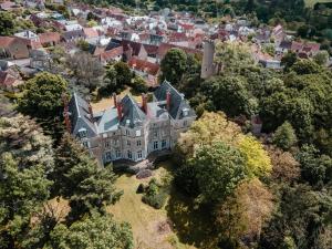 an aerial view of a large house in a city at Château de Sainte-Sévère in Sainte-Sévère-sur-Indre