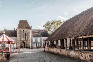 an old town with a church and a street at Château de Sainte-Sévère in Sainte-Sévère-sur-Indre +6 photos