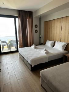 Postel nebo postele na pokoji v ubytování RiA BLU DELUXE HOTEL