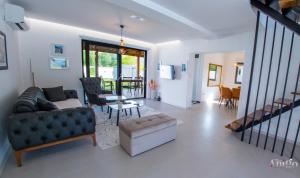 a living room with a couch and a table at Bunska Venera in Blagaj