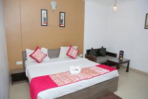 Postel nebo postele na pokoji v ubytování Hotel Sai Group