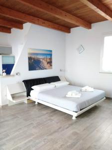 Ένα ή περισσότερα κρεβάτια σε δωμάτιο στο La Dolce Vita