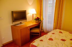 Rúm í herbergi á Auberge Communale à l'Union