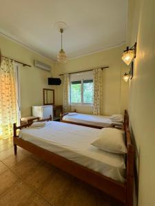 Postel nebo postele na pokoji v ubytování Hotel Jenny