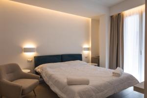 Postel nebo postele na pokoji v ubytování Aura Room
