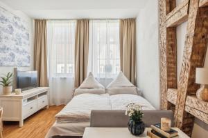 Postel nebo postele na pokoji v ubytování Loft über den Dächern Coburgs, Parkplatz