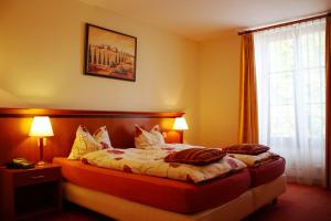 Rúm í herbergi á Auberge Communale à l'Union