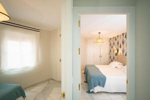 Posteľ alebo postele v izbe v ubytovaní San Clemente House
