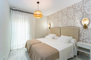 Posteľ alebo postele v izbe v ubytovaní San Clemente House