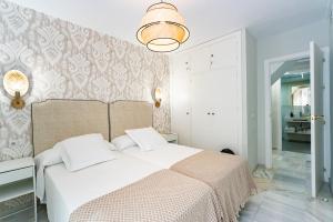Posteľ alebo postele v izbe v ubytovaní San Clemente House