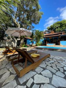 Swimmingpoolen hos eller tæt på Pousada Fora da Rotina