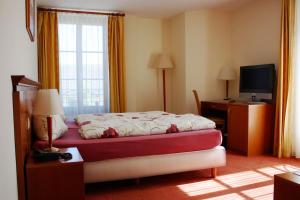 Rúm í herbergi á Auberge Communale à l'Union