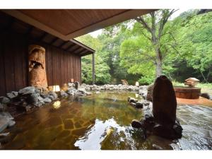 a pond in the middle of a yard at La Vista Akangawa in Akankohan
