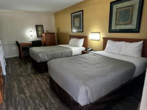 Postel nebo postele na pokoji v ubytování Quality Inn Nacogdoches Near University