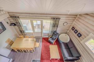 a view of a dining room and living room in a tiny house at Holiday Apartment Lomahimos 10 in Himos