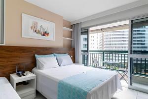 a bedroom with a large bed and a balcony at Hotel VISION in Brasília +243 photos