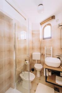 a bathroom with a toilet and a sink at Villa Purić in Rovinj +50 photos
