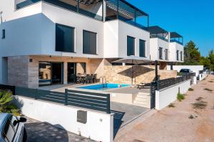 an image of a house with a swimming pool at Villa Sv. Josip in Srima