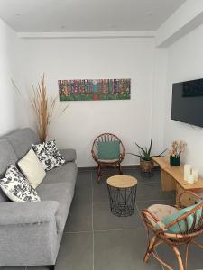 a living room with a couch and a table at Luxury apartment close to everything in Granada