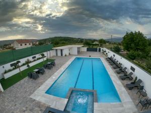 a swimming pool on the roof of a building at Villa XY in Blagaj