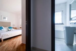 Postel nebo postele na pokoji v ubytování Ermes by PortofinoHomes