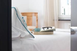 Postel nebo postele na pokoji v ubytování Ermes by PortofinoHomes