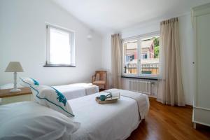 Postel nebo postele na pokoji v ubytování Ermes by PortofinoHomes