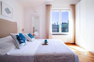 Postel nebo postele na pokoji v ubytování Ermes by PortofinoHomes