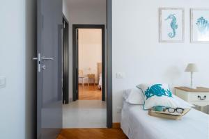 Postel nebo postele na pokoji v ubytování Ermes by PortofinoHomes