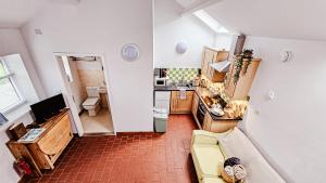 an overhead view of a kitchen and a living room at Wild Valley Bunkhouse in Llanrhaeadr-ym-Mochnant
