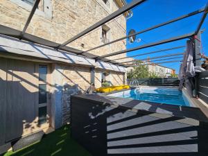 a patio with a swimming pool in a building at Villa Vega in Višnjan