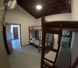 a room with two bunk beds and a hallway at C U Hostel in Trincomalee