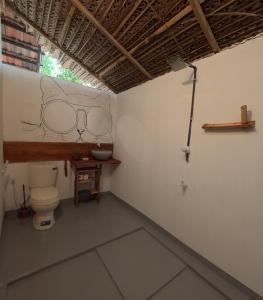 a bathroom with a toilet and a sink at C U Hostel in Trincomalee
