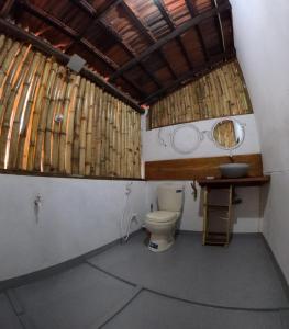 a bathroom with a toilet and a sink at C U Hostel in Trincomalee