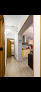 a hallway of a room with a kitchen and a living room at Alojamiento el halcon in Santoña