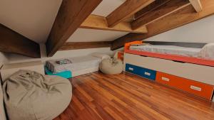 a room with two bunk beds and a wooden floor at Cabirol in Camprodon