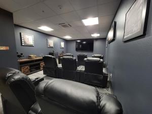 a salon with a waiting room with leather chairs at Brand New Urban Loft Free Parking Close To Mayo in Rochester