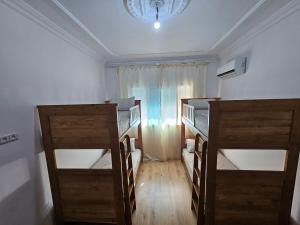 A bed or beds in a room at Eftalya Hostel Tanger