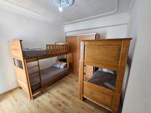 A bed or beds in a room at Eftalya Hostel Tanger