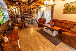 a living room with a couch and a table at Chalupa Katka in Dolný Kubín