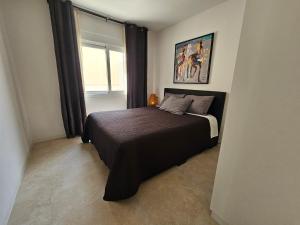 a bedroom with a bed and a window at Holiday Home KyDo - Heated Pool - Roof Terrace - San Pedro del Pinatar in San Pedro del Pinatar +44 photos