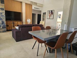 a living room with a table and a couch at Holiday Home KyDo - Heated Pool - Roof Terrace - San Pedro del Pinatar in San Pedro del Pinatar