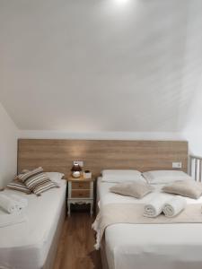 A bed or beds in a room at Green House Skiathos