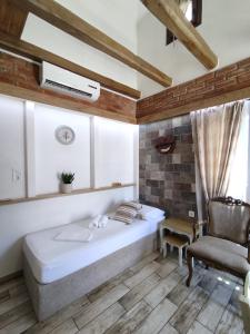 A bed or beds in a room at Green House Skiathos