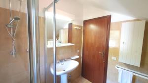 a bathroom with a sink and a shower with a shower at Naturalmente in Premilcuore +20 photos