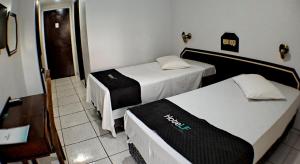 Postel nebo postele na pokoji v ubytování Hotel LF By Feliciano