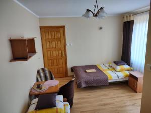 Postel nebo postele na pokoji v ubytování Pokoje Goscinne Bartosz