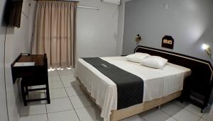 Postel nebo postele na pokoji v ubytování Hotel LF By Feliciano