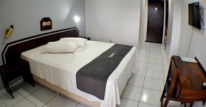 Postel nebo postele na pokoji v ubytování Hotel LF By Feliciano